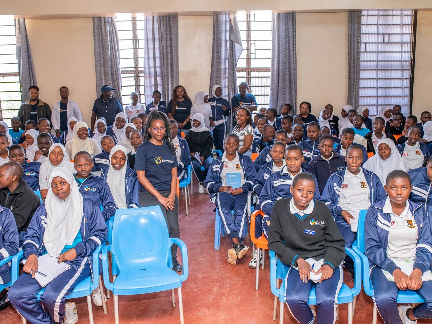 Students and the Flutterwave team in the school hall in Kibera